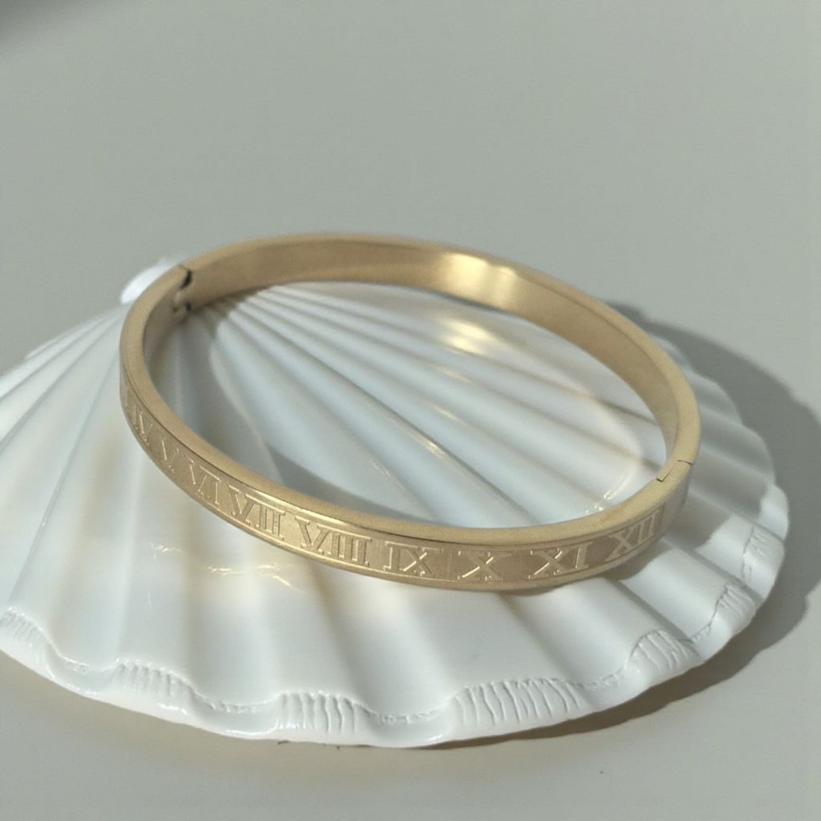'IT Girl' Gold stainless steel bracelet.
