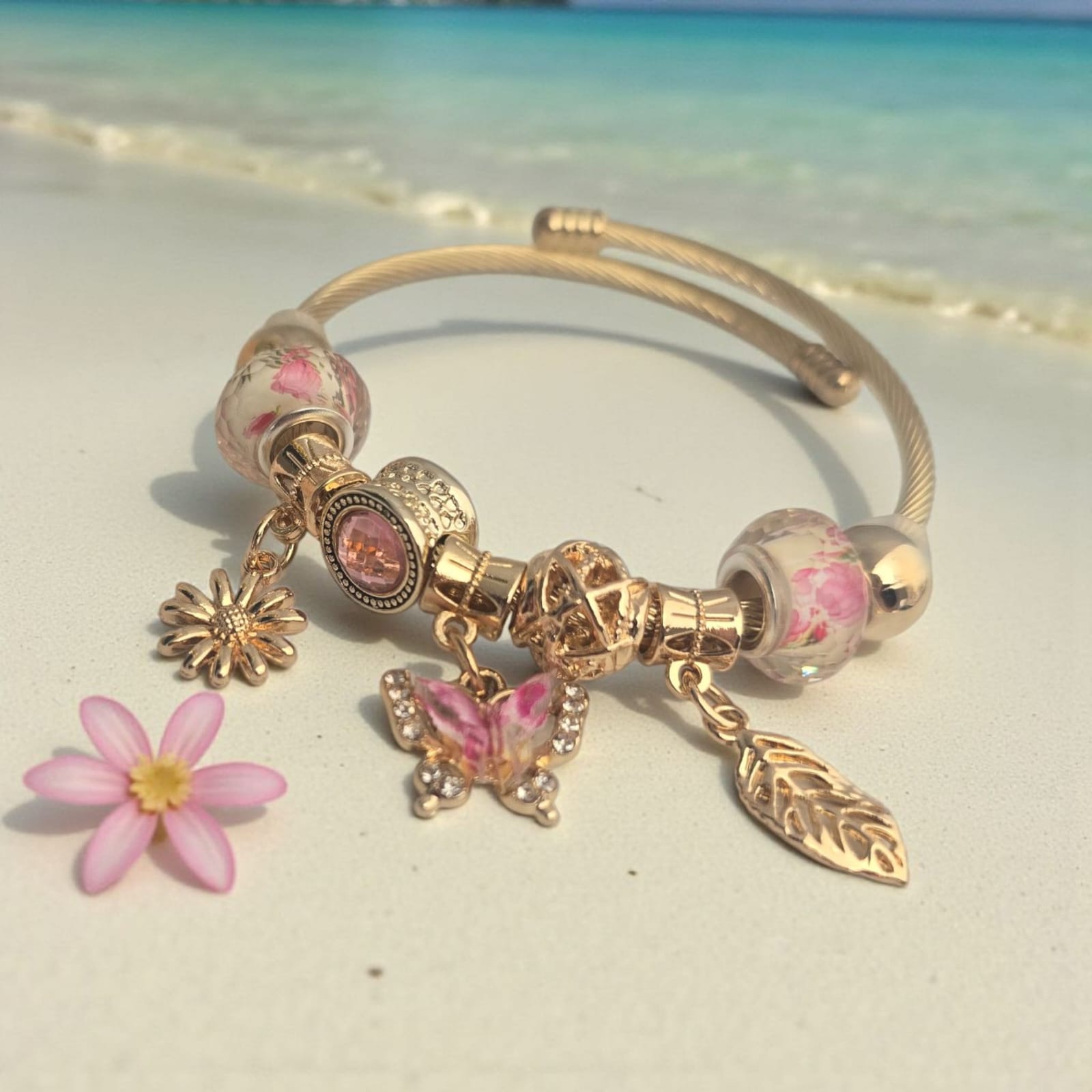 'Treasures of the Tide' Gold stainless steel bracelet.