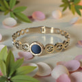 'Summer Loving' Gold stainless steel cuff bracelet.